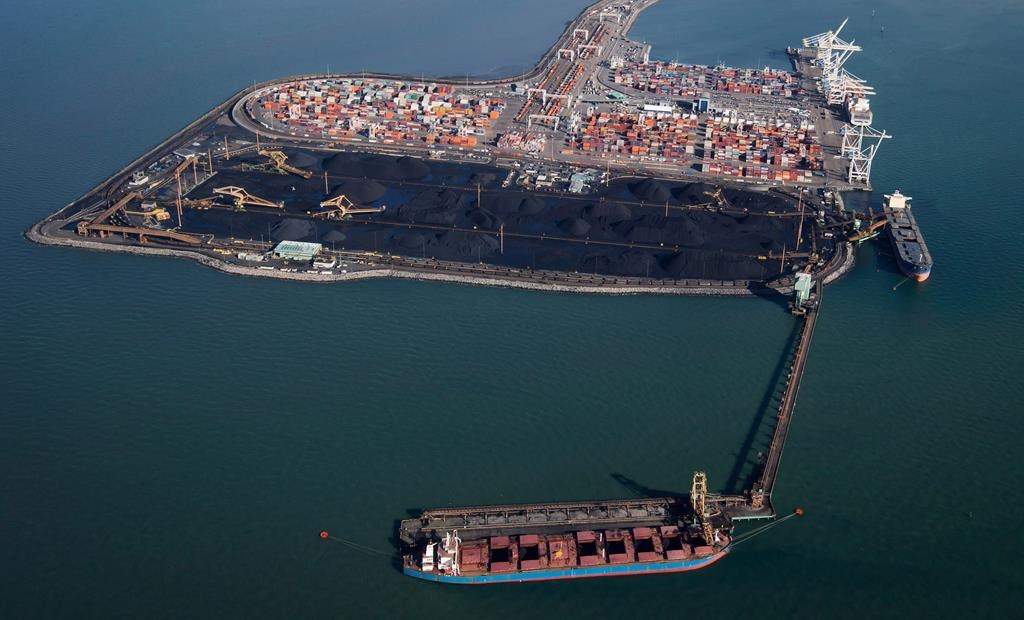 Ships are loaded with coal at terminals in Delta, B.C. THE CANADIAN PRESS/Darryl Dyck.