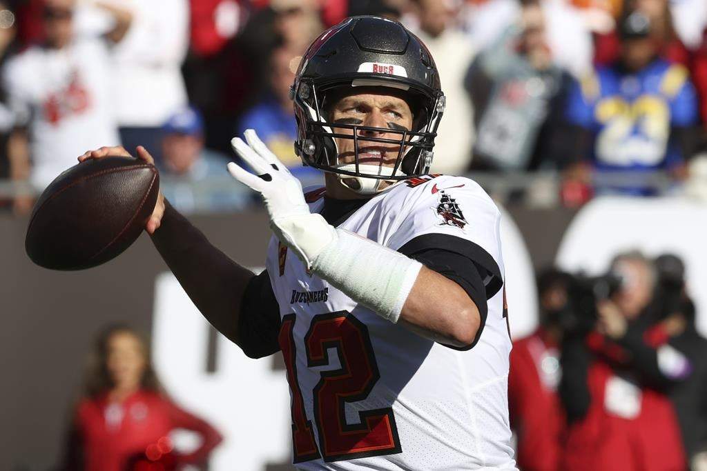Tampa Bay Buccaneers quarterback Tom Brady throws a pass against the Los Angeles Rams during the first half of an NFL divisional round playoff football game Jan. 23, 2022, in Tampa, Fla.