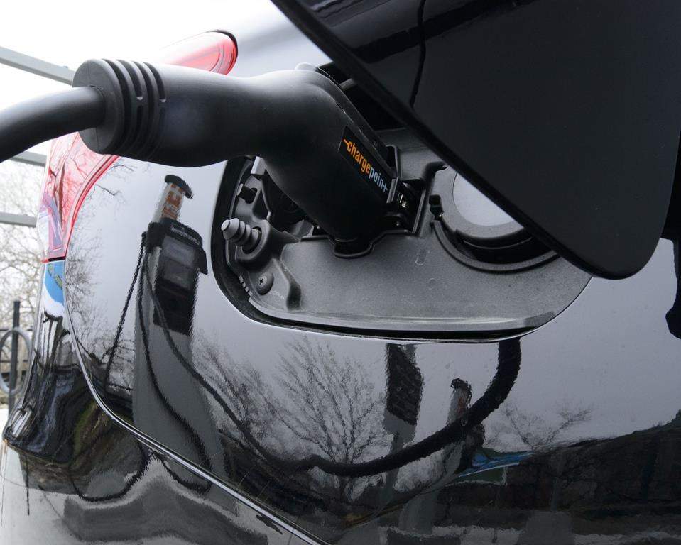 A car is charged at a charge station for electric vehicles on Parliament Hill in Ottawa on Wednesday, May 1, 2019.