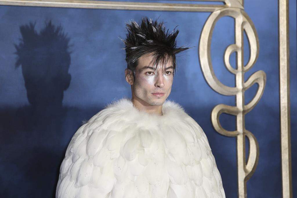 Actor Ezra Miller poses for photographers upon arrival at the premiere of the film 'Fantastic Beasts: The Crimes of Grindelwald', at a central London cinema, Tuesday, Nov. 13, 2018.