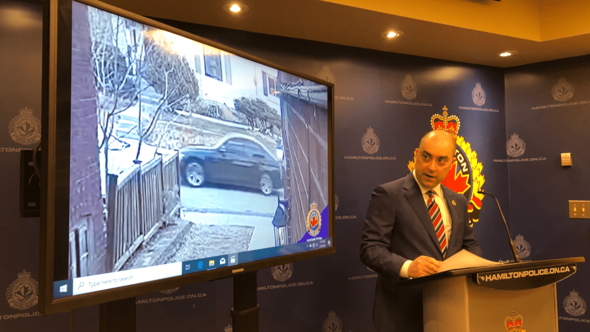 Detective Sergeant Steve Berezuik reveals an image of a suspect vehicle involved in the city's first homicide of the year.