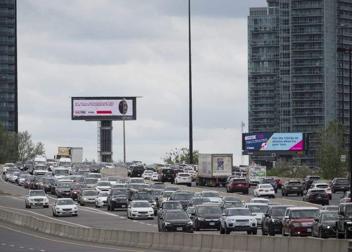 Vehicles drive along the Gardiner Expressway in Toronto at the start of the May long weekend on Saturday, May 22, 2021. 