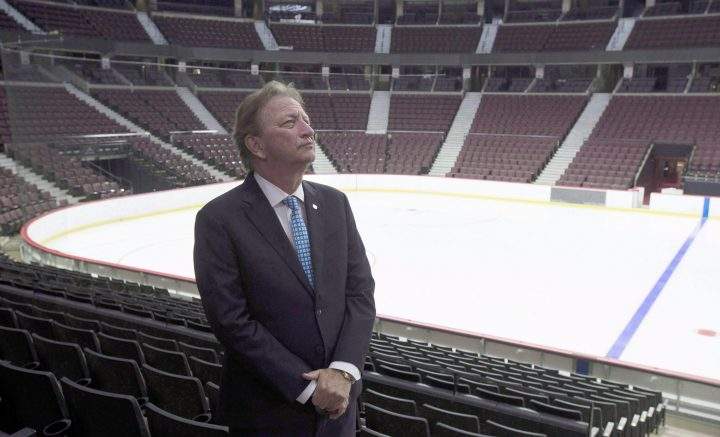 Ottawa Senators owner Eugene Melnyk stands near the ice as members of the media are given a tour of changes to the Canadian Tire Centre in Ottawa on September 7, 2017.
