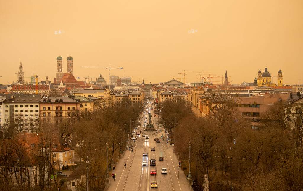 A view of the city center in Bavaria, Munich. The city is stained a red/orange colour
