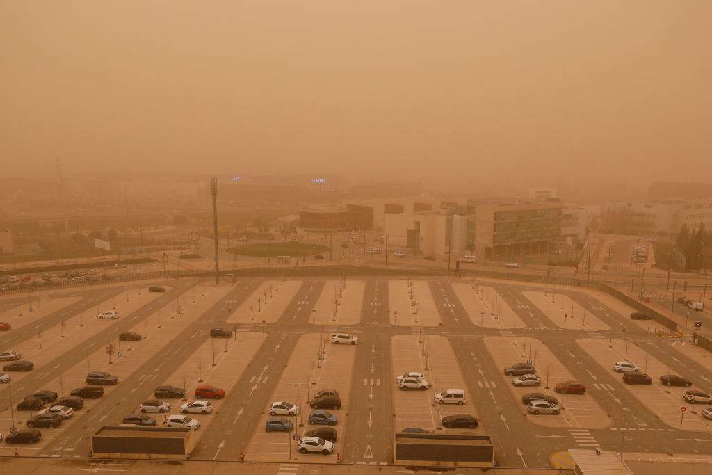 Saharan dust covers a parking lot in Granada, Spain
