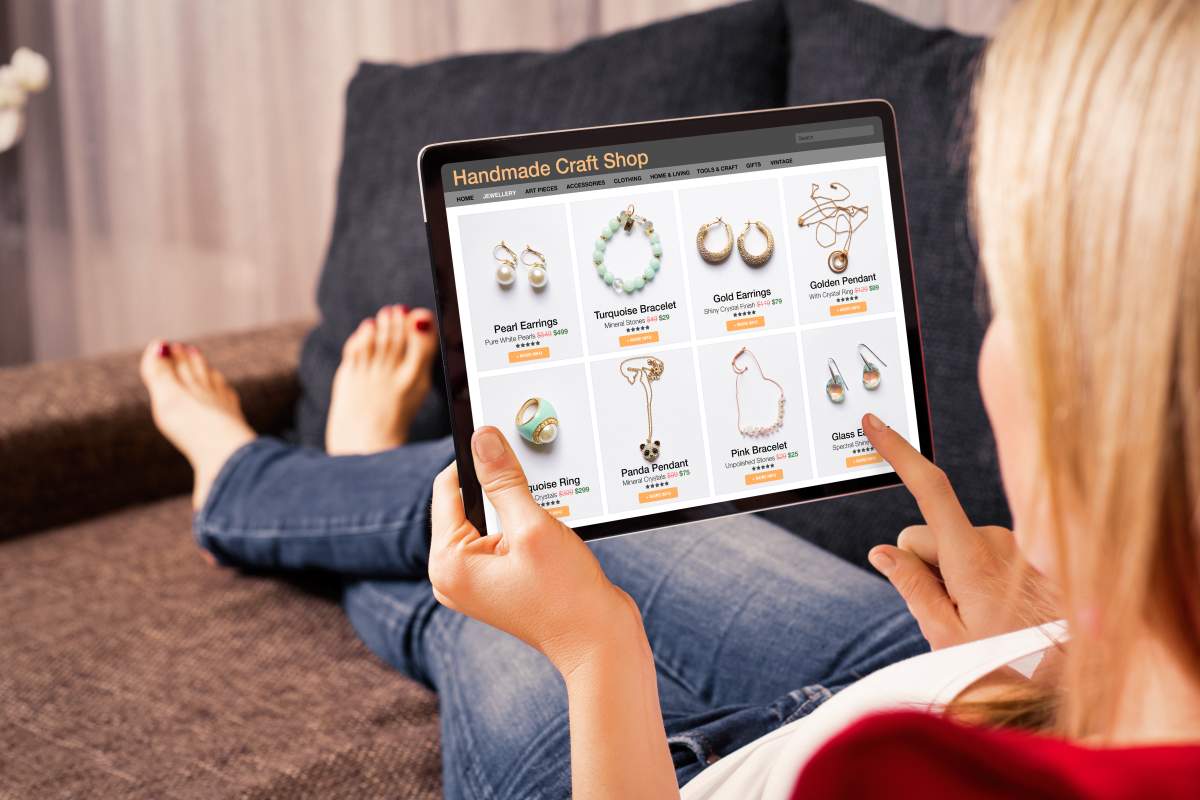 Woman browsing custom and hand made jewelry online.