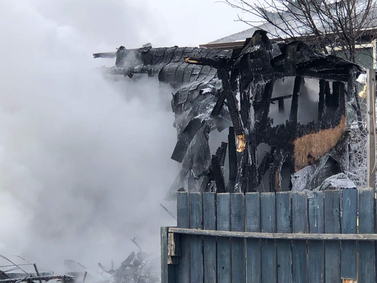 Calgary firefighters work to put out a garage fire in Taradale on March 9, 2022.