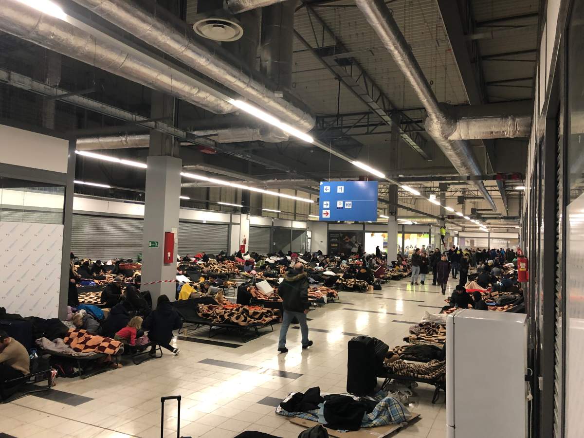 At the Korczowa refugee centre in Poland, refugees fleeing Ukraine rest on cots, March 3, 2022.