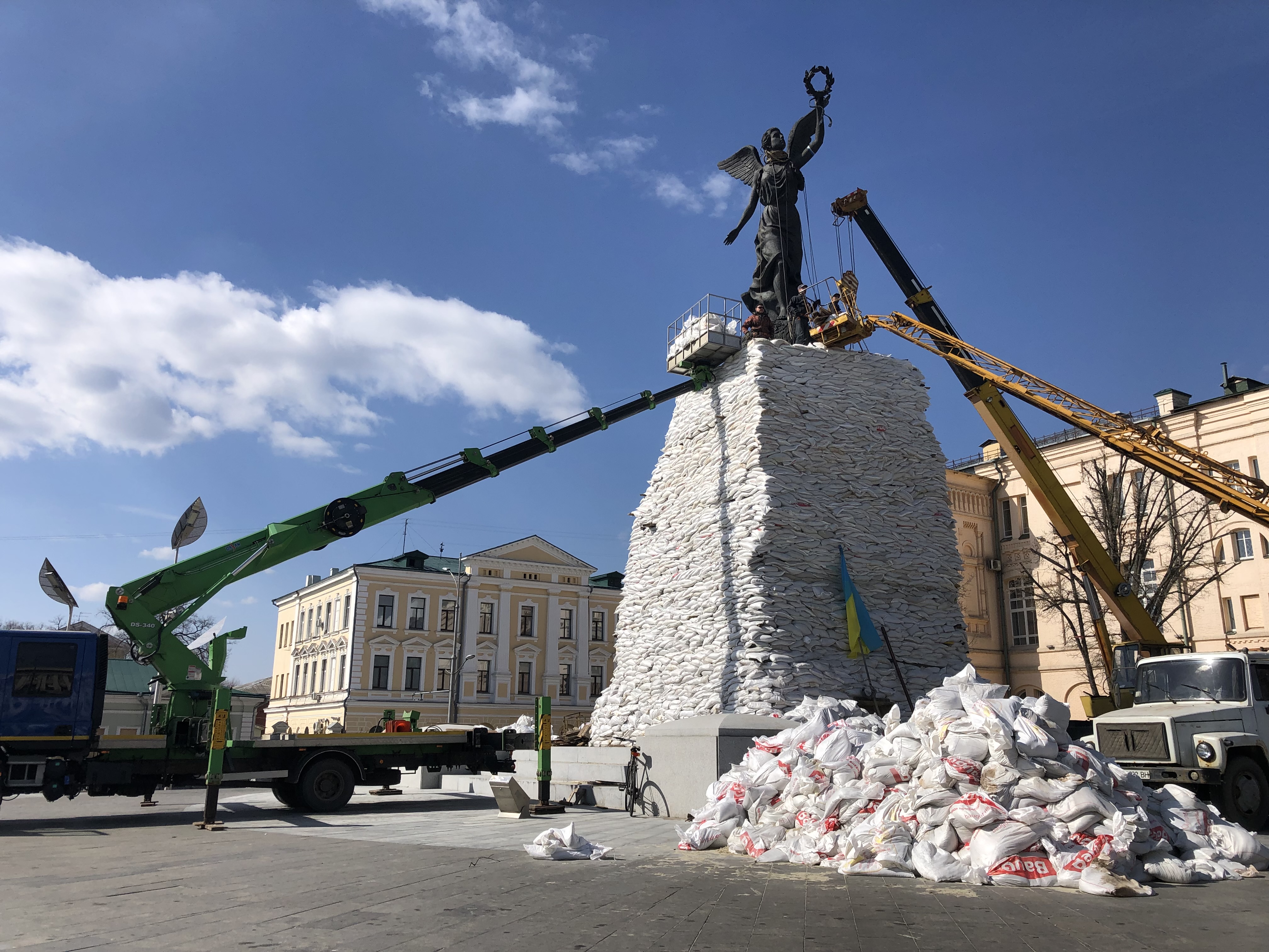 Sandbags go up around the independence monument in Kharkiv, Ukraine, March 29, 2022.
