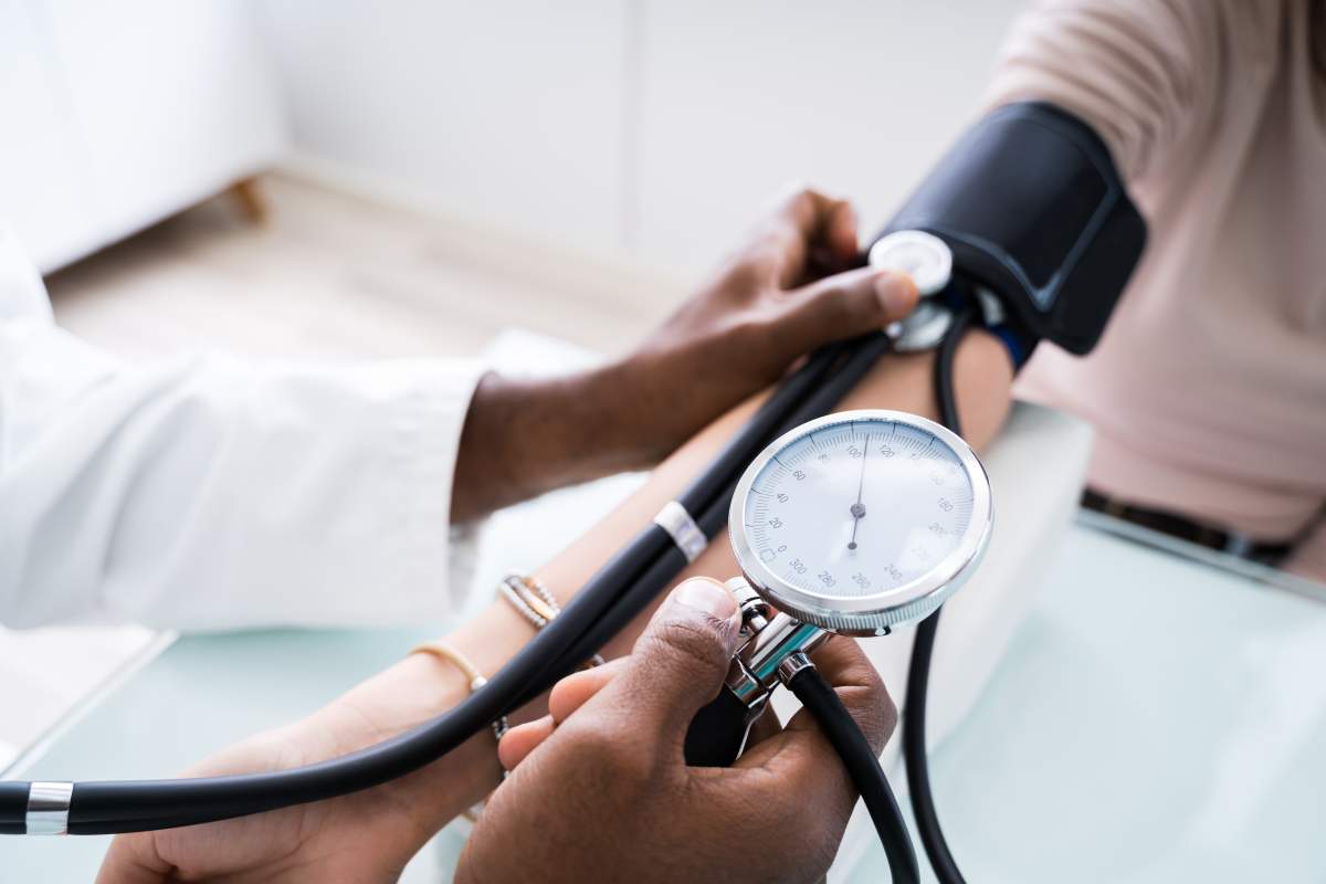 File image of a doctor checking blood pressure.