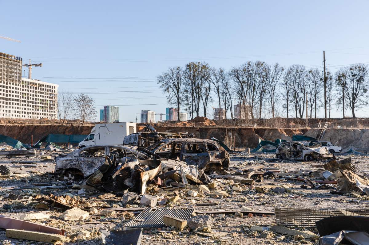 Destroyed cars seen at a bomb site in Kyiv.