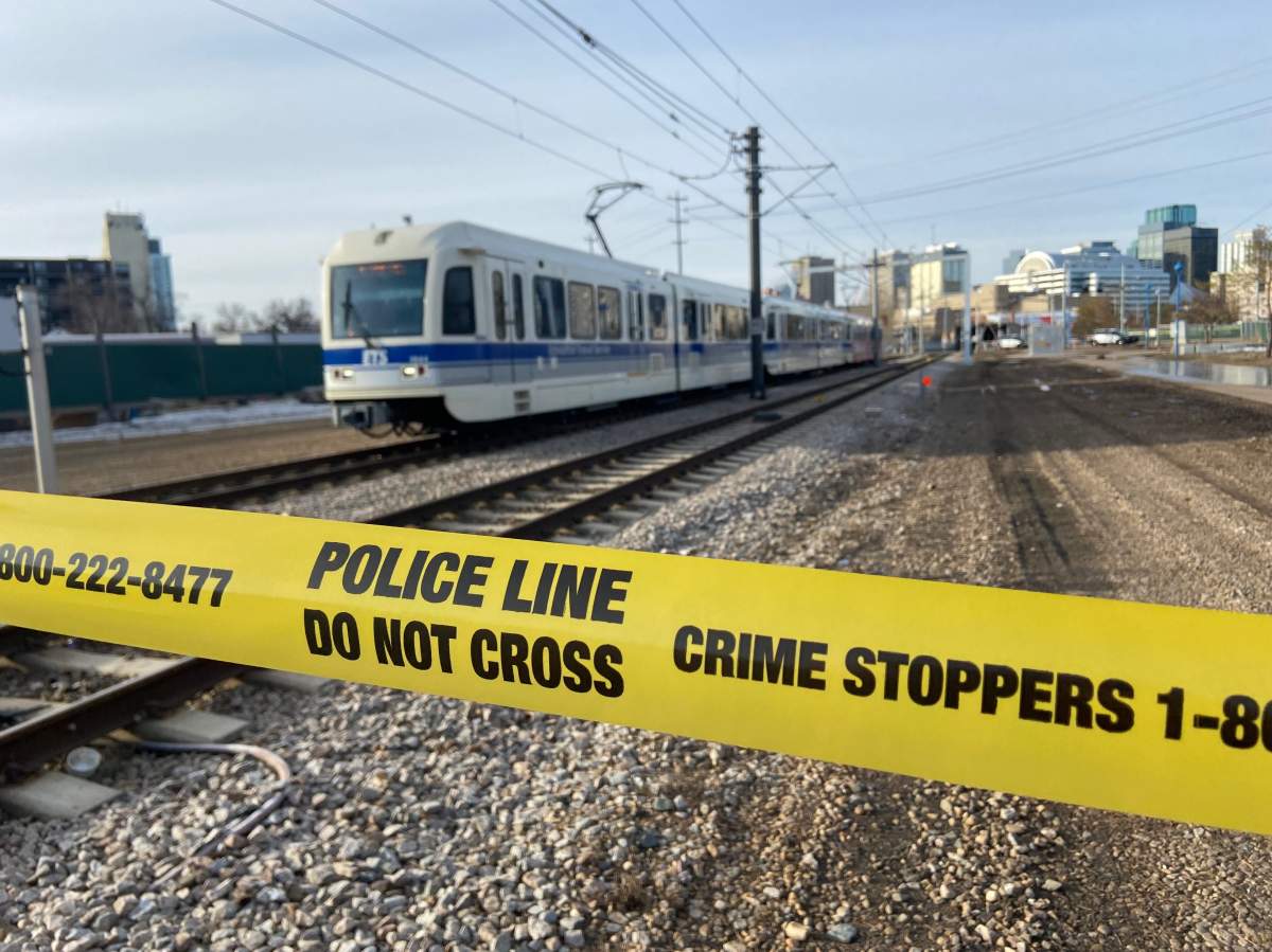 Edmonton police on scene of an incident at the 95 Street LRT crossing north of 105 Avenue Friday, March 25, 2022.