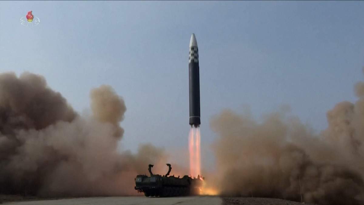 A large ICBM is seen taking off.