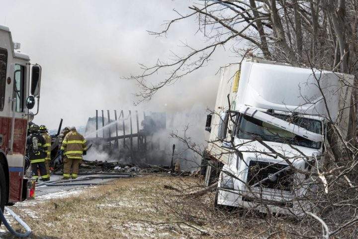 Firefighters work at the scene of a multi-vehicle crash on Interstate 81 North near the Minersville exit in Foster Township, Pa., Monday, March 28, 2022.