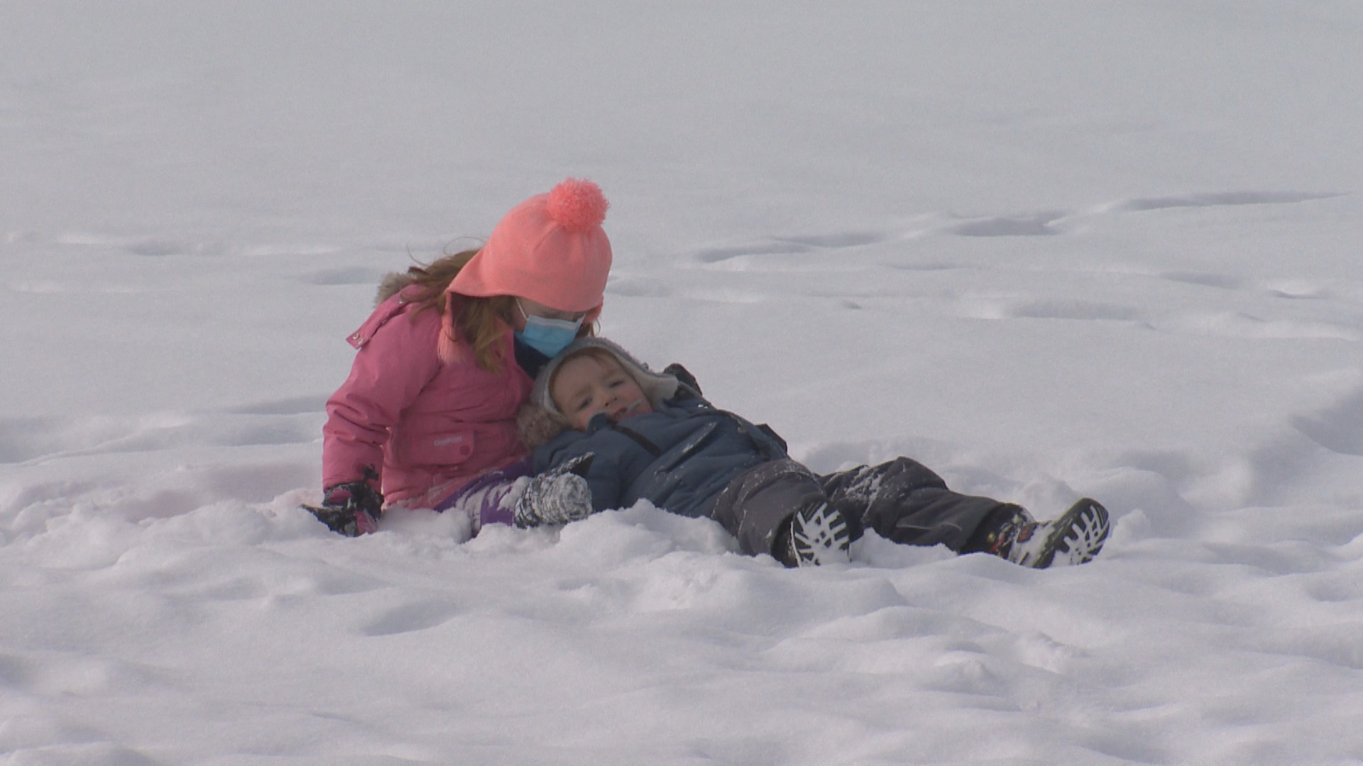 Borther and sister enjoying a 'snow day' at FortWhyte Alive on Feb. 28, 2022.