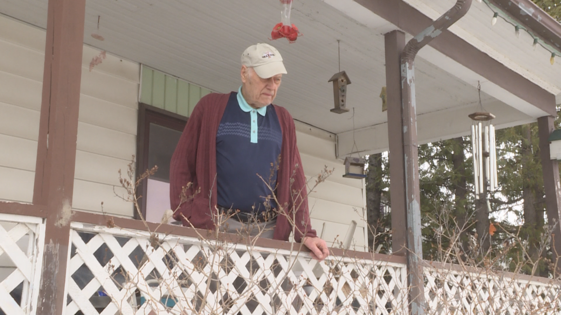 88-year-old Transcona resident John Van Dasselaar pauses to consider the overland flooding which has overtaken his yard and continues pooling in his basement.