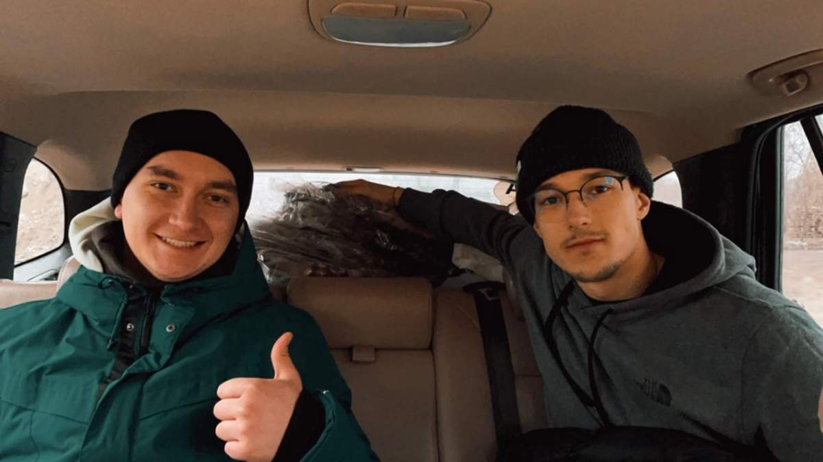 Ivan Taranenko, right, in van loaded with equipment for Ukrainian fighters.