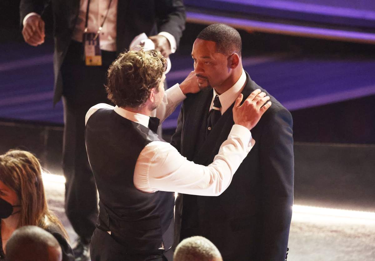 Bradley Cooper comforts Will Smith during the show at the 94th Academy Awards at the Dolby Theatre at Ovation Hollywood on Sunday, March 27, 2022. (Myung Chun / Los Angeles Times via Getty Images)