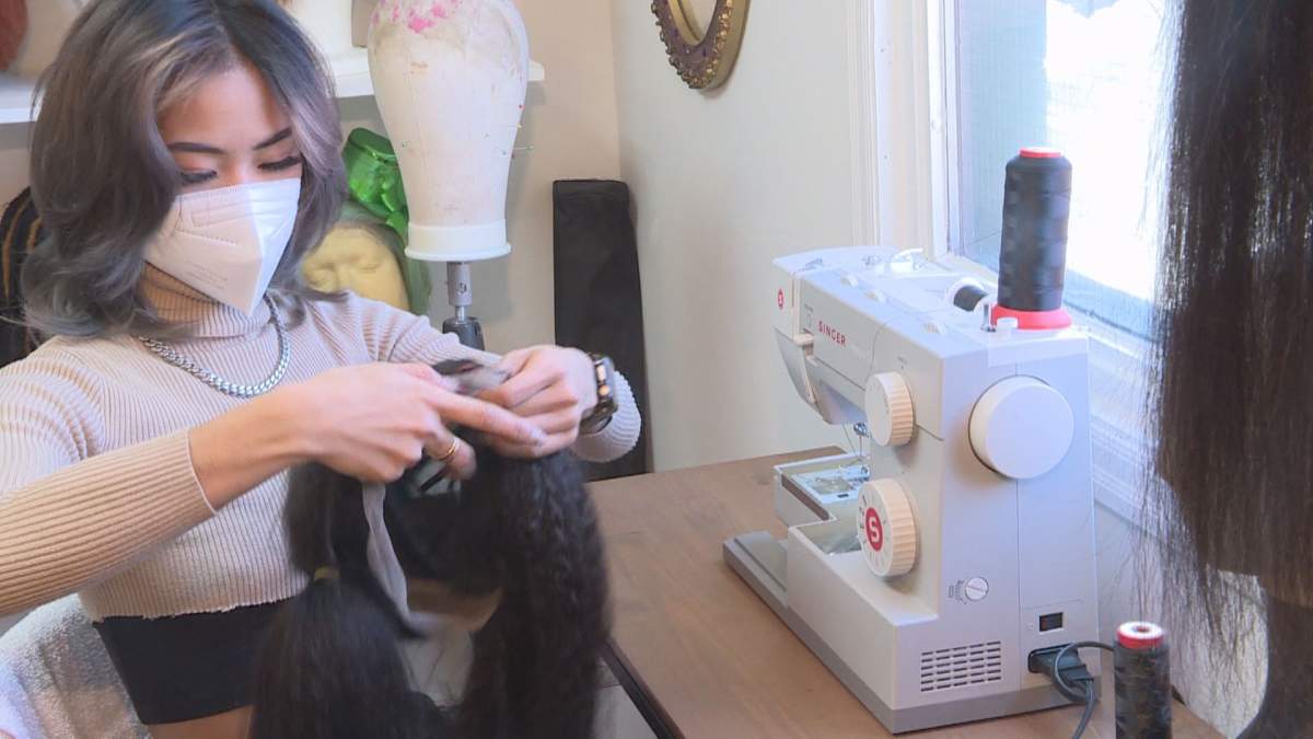 Clarissa Dela Cruz started colouring wigs at Hairbru, but is now learning African-style braiding.
