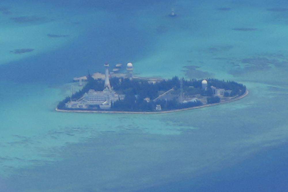 Chinese structures and buildings at the man-made island on Johnson reef at the Spratlys group of islands in the South China Sea are seen on Sunday March 20, 2022. (AP Photo/Aaron Favila)