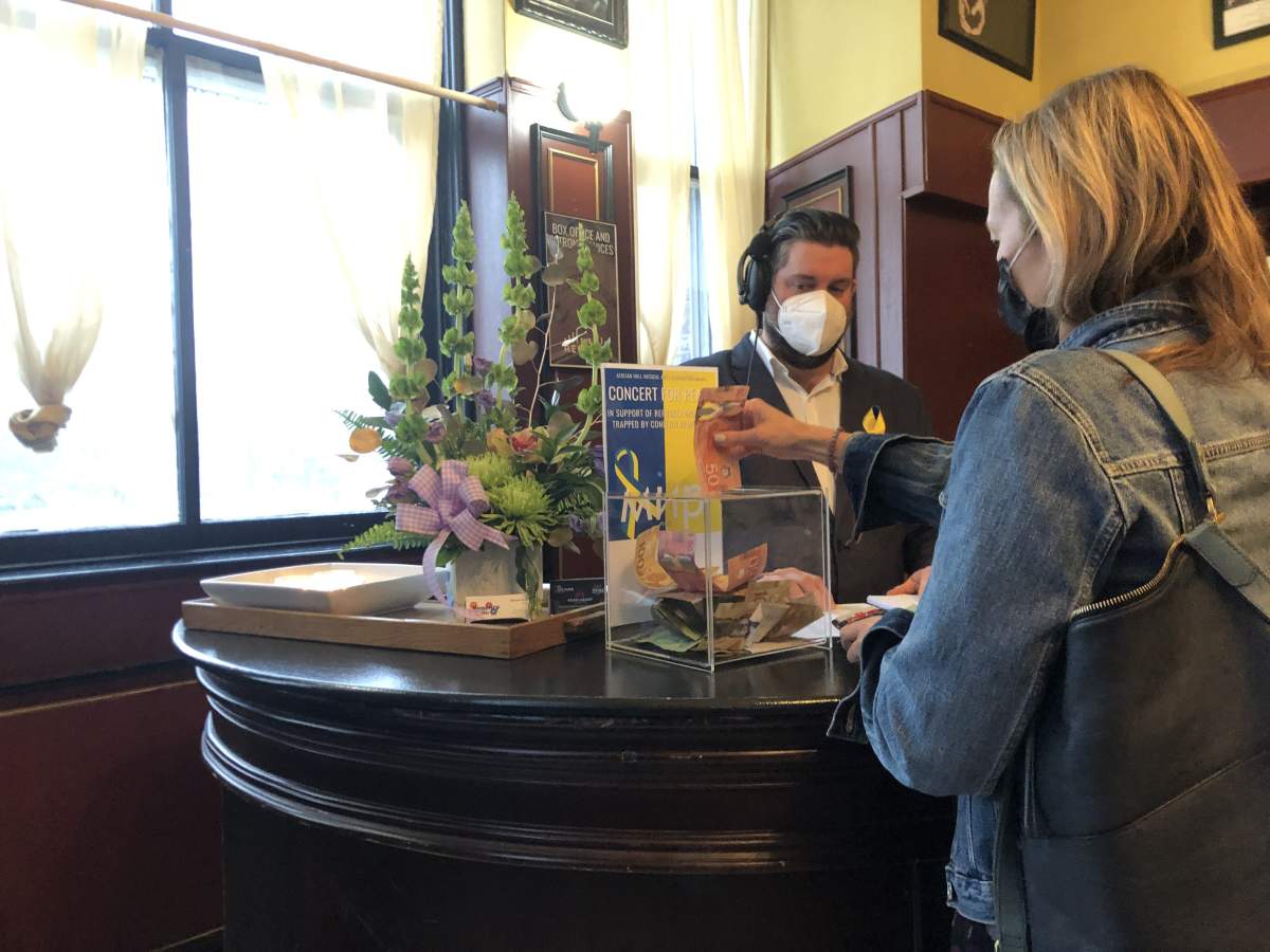 People donating to the Aeolian Hall Concert for Peace. March 24, 2022