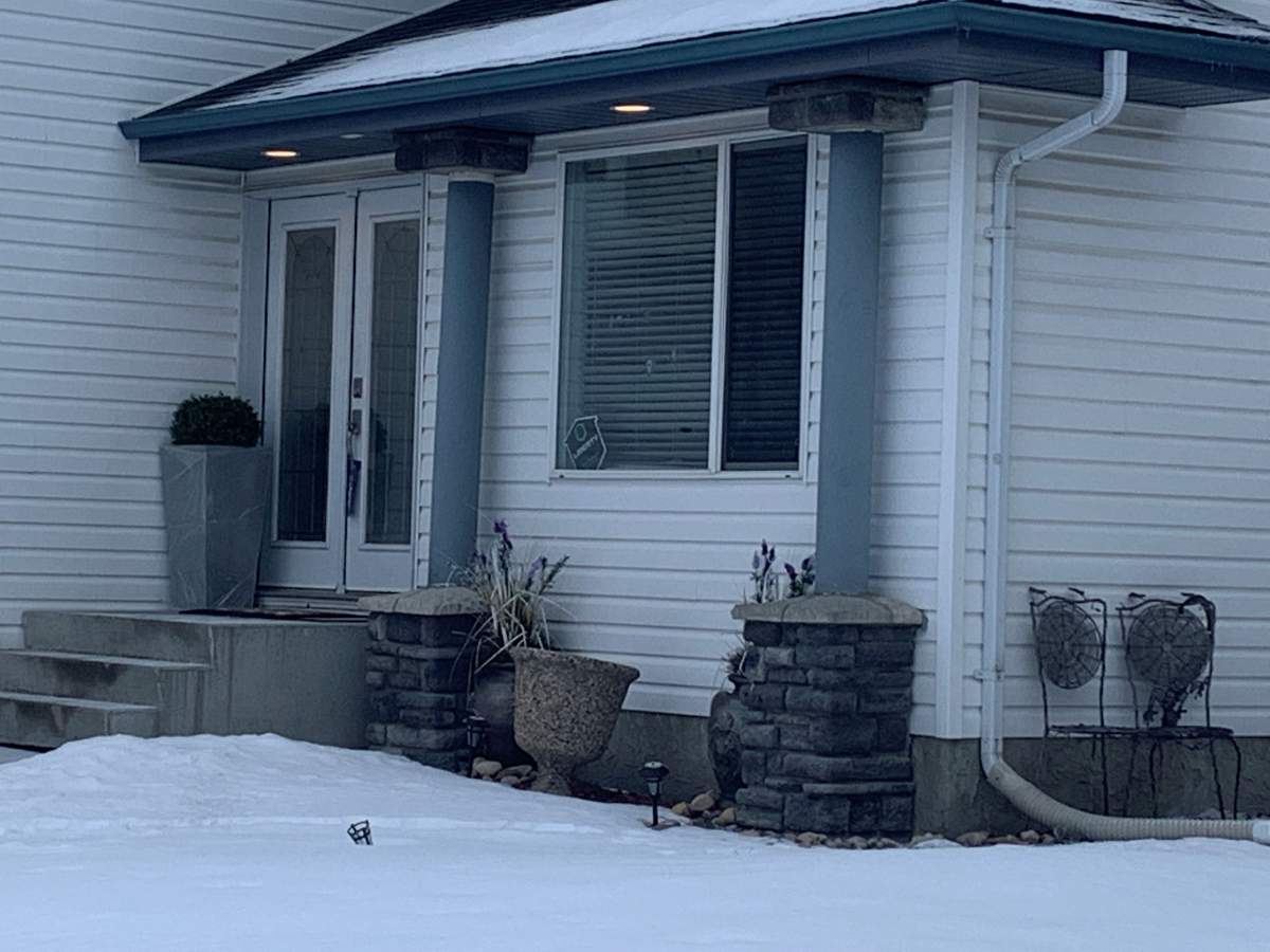 Edmonton police investigate in the area of Heath Road and Riverbend Road Monday, March 14, 2022.