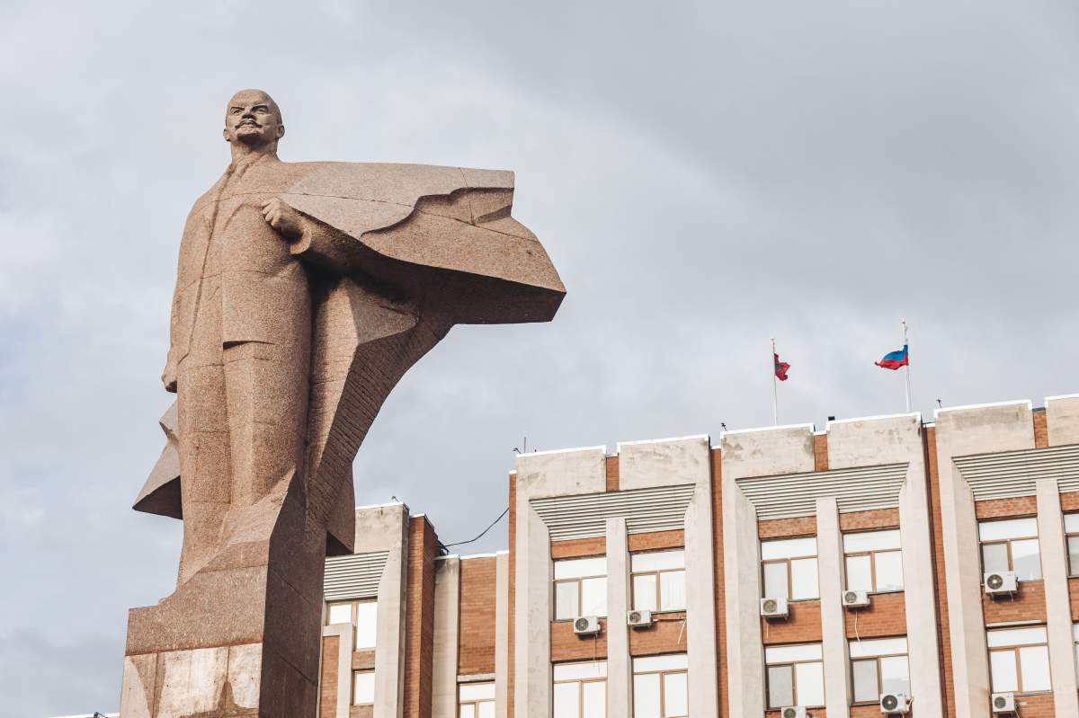 A Societ-style statue of Vladimir Lenin seen in front of the Presidential Palace in Tiraspol, capital of Transnistria. (Photo by Diego Herrera/SOPA Images/LightRocket via Getty Images)