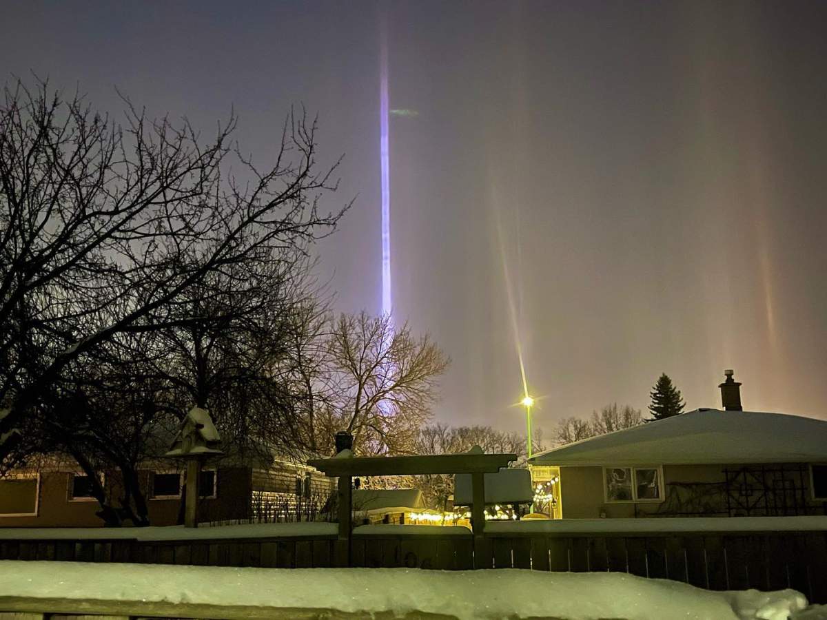 Light pillars light up the Regina sky.