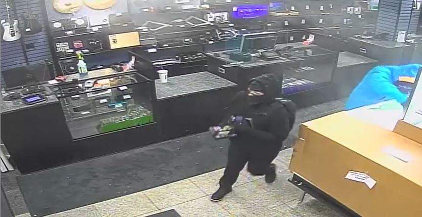 Edmonton police are hoping to identify a man and woman responsible for an armed robbery at a pawn shop in the area of 126 Avenue and Fort Road on Monday, Jan. 24, 2022.
