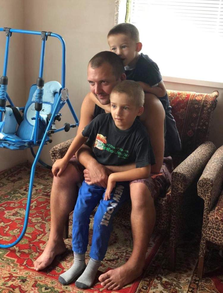 Yana Sheina’s uncle is seen with his two sons. Living near the Russian border in northeastern Ukraine, her family were among the first to encounter invading Russian troops.