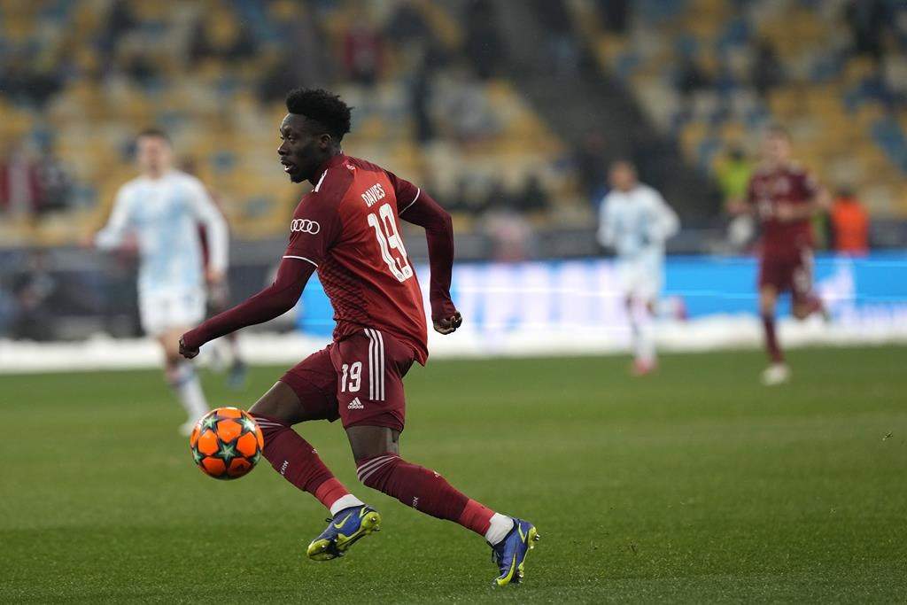 Bayern's Alphonso Davies controls the ball during the Champions League group E soccer match between Dynamo Kyiv and Bayern Munich, at the Olimpiyskiy Stadium in Kyiv, Ukraine, Tuesday, Nov. 23, 2021. Bayern Munich manager Julian Nagelsmann says Canadian star Alphonso Davies should be back within two weeks. (AP Photo/Efrem Lukatsky).