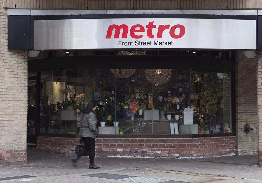 A woman walks pass a Metro grocery store in Toronto on Wednesday, Nov. 1, 2017. THE CANADIAN PRESS/Doug Ives.
