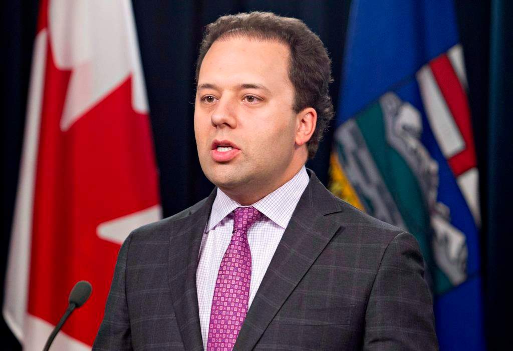 Alberta Justice Minister Jonathan Denis comments on an auditor general’s report in Edmonton on Thursday, Aug. 7, 2014.