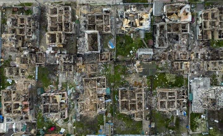 Destroyed houses are photographed in Irpin, on the outskirts of Kyiv, Ukraine, Saturday, April 30, 2022.
