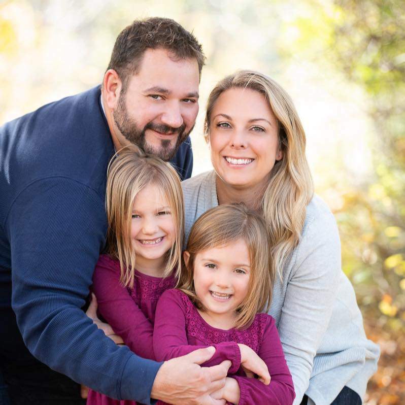 Adam Delorey with his wife and two children.
