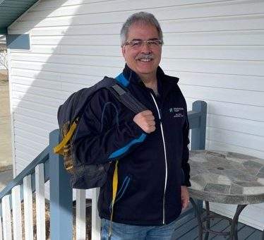 Bill Tonita with his lost backpack that was returned to him by a complete stranger.