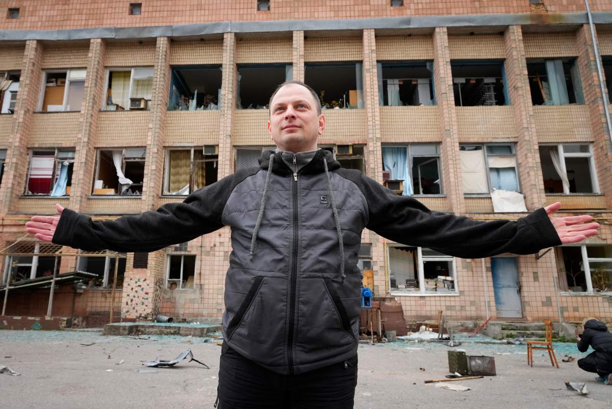Maxim Shevchuk, the deputy head of the state agency managing the Chernobyl exclusion zone, talks near a building looted by Russian troops adjacent to the Chernobyl nuclear power plant near Chernobyl, Ukraine, Saturday, April 16, 2022.