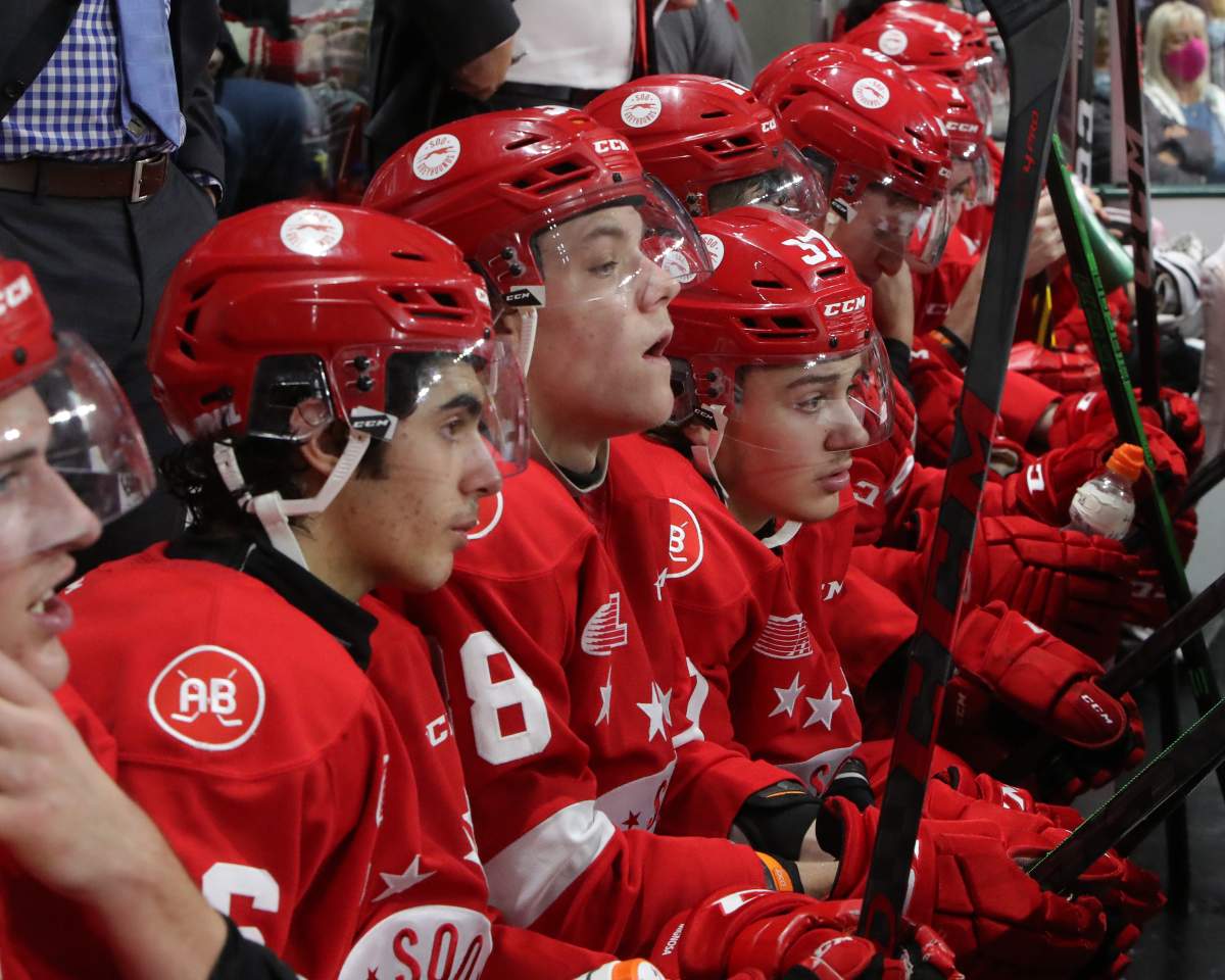 Soo Greyhounds players sitting on the bench