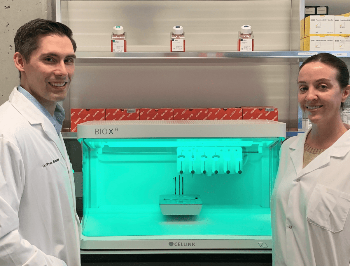 Dr. Ryan Flannigan and research assistant Meghan Robinson with bioprinter