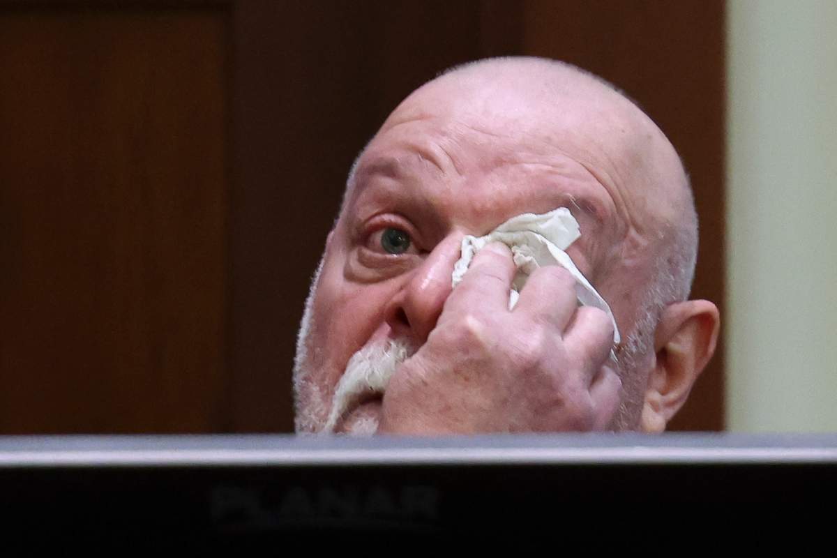 Isaac Baruch wipes tears as he testifies during Johnny Depp's defamation trial against his ex-wife Amber Heard at the Fairfax County Circuit Courthouse in Fairfax, Virginia, on April 13, 2022.