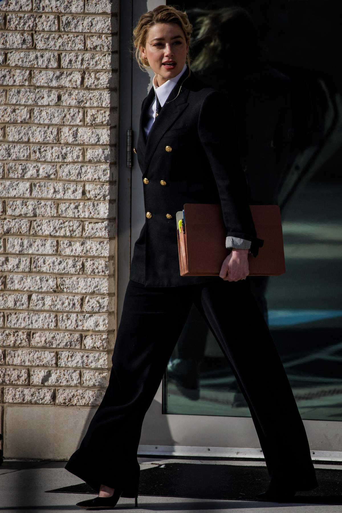 US actress Amber Heard leaves the Fairfax County Circuit Court in Fairfax, Virginia, on April 13, 2022.