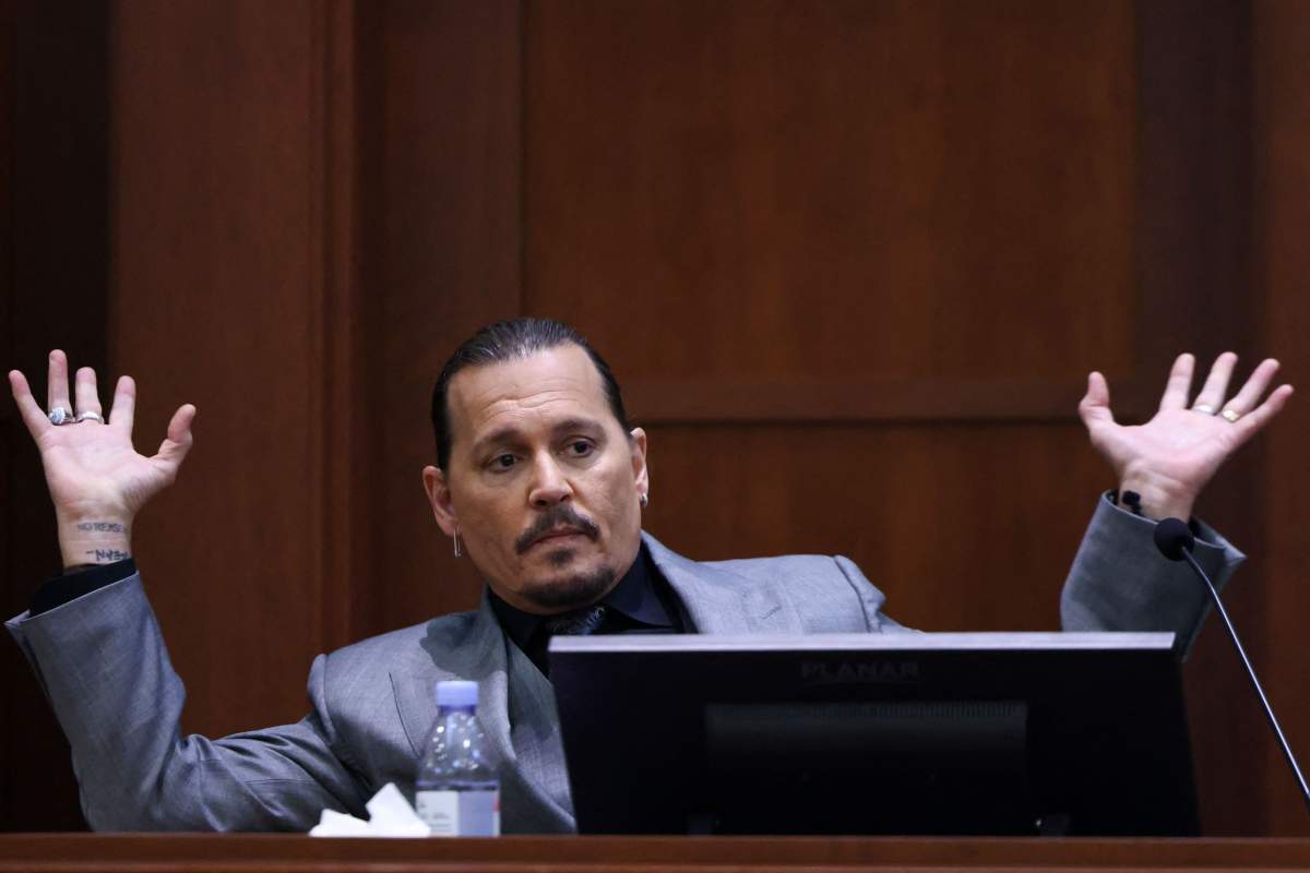 Actor Johnny Depp testifies during his defamation trial against his ex-wife Amber Heard at the Fairfax County Circuit Courthouse in Fairfax, Virginia, April 20, 2022.