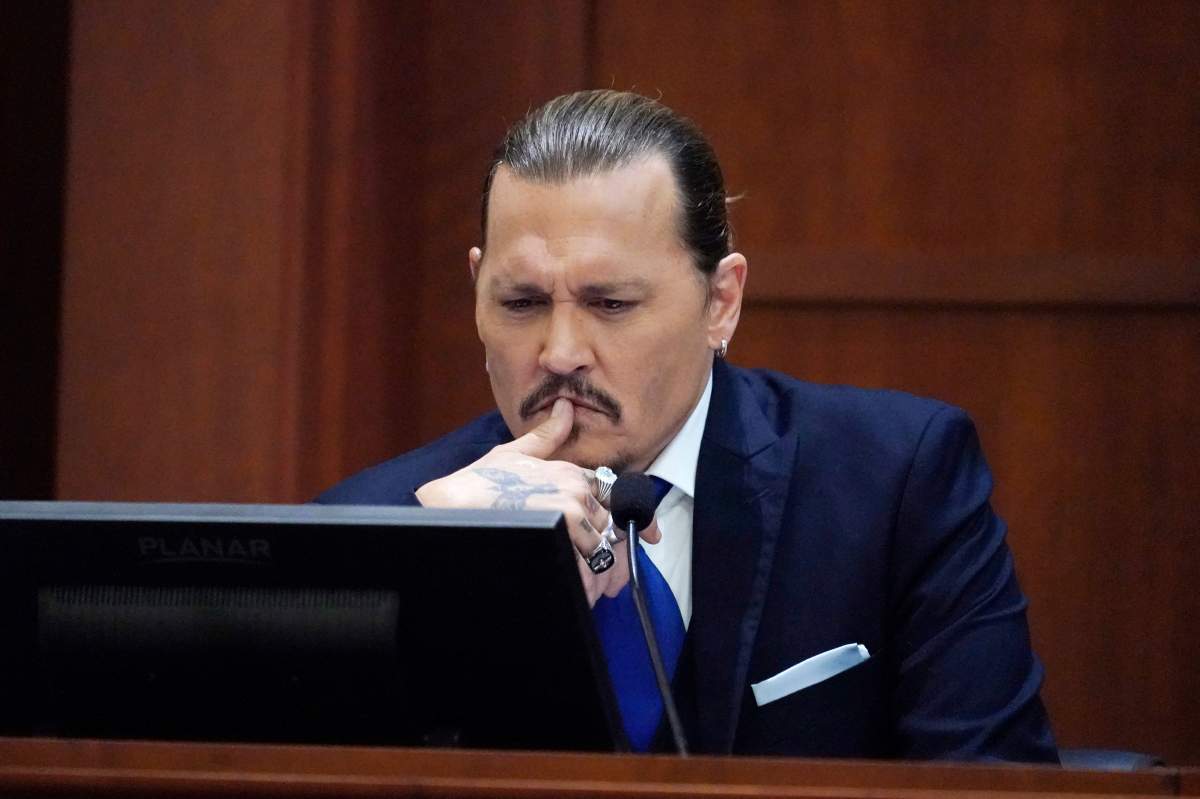 Actor Johnny Depp testifies in the courtroom at the Fairfax County Circuit Courthouse in Fairfax, Virginia, April 25, 2022.