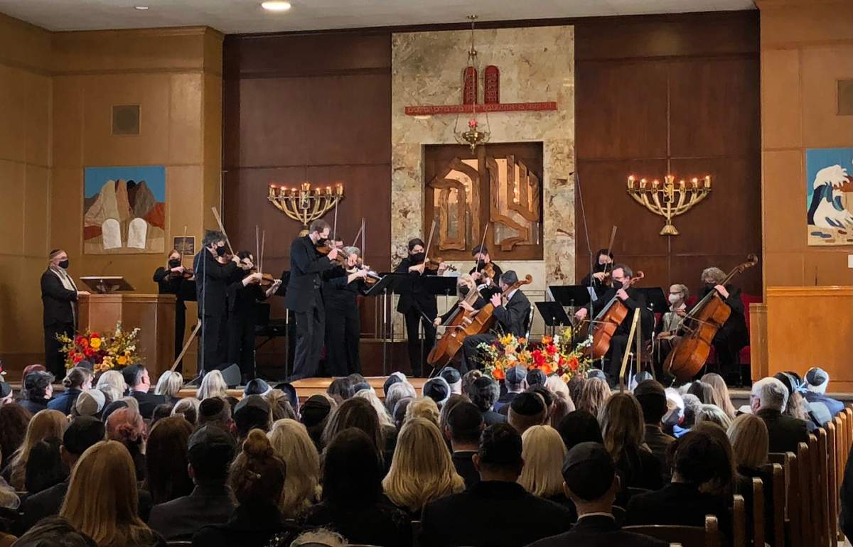 A string ensemble plays for those gathered to mourn the loss of Boris Brott, who was killed in a hit-and-run last week.