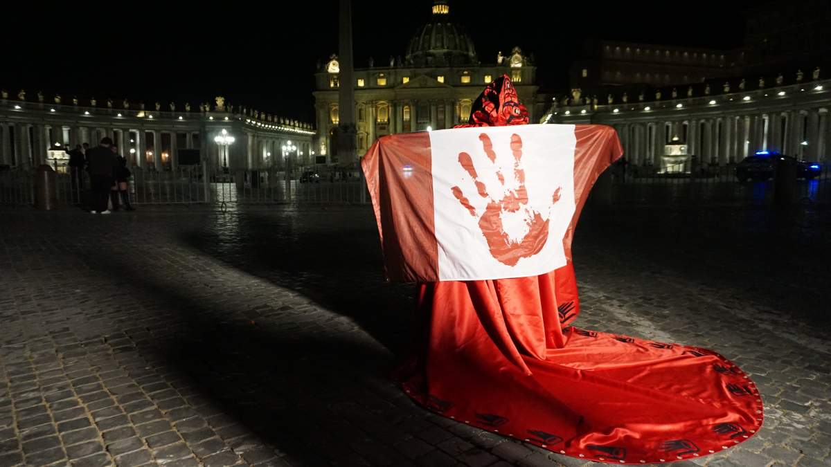 Palexelsiya Lorelei Williams has been wearing a red cape made by Morgan Asoyuf and the genocide flag of Canada in front of historic sites in Rome this week to raise awareness of the MMIWG2S crisis in Canada. She's seen here in Rome on March 29, 2022.