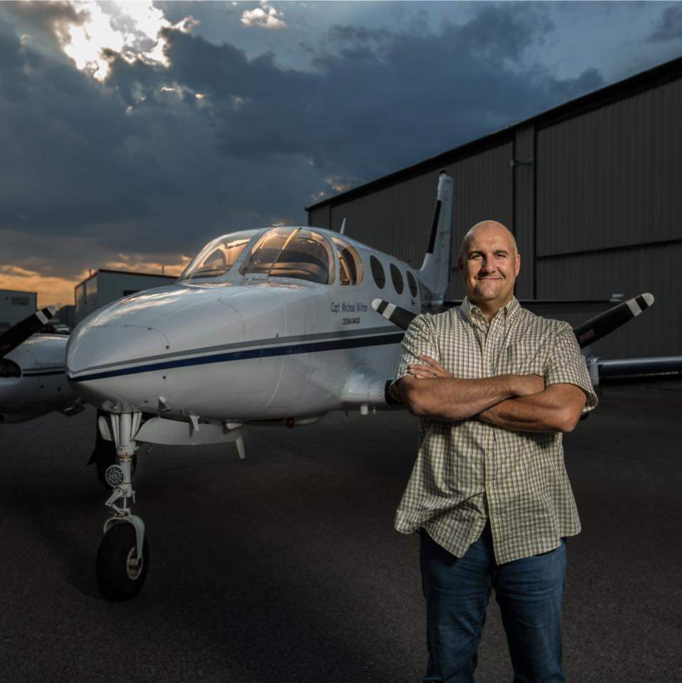 Michael Wilton stands in front of a plane, in an undated photo. Wilton died in a plane crash near Springbank Airport on April 22, 2022.