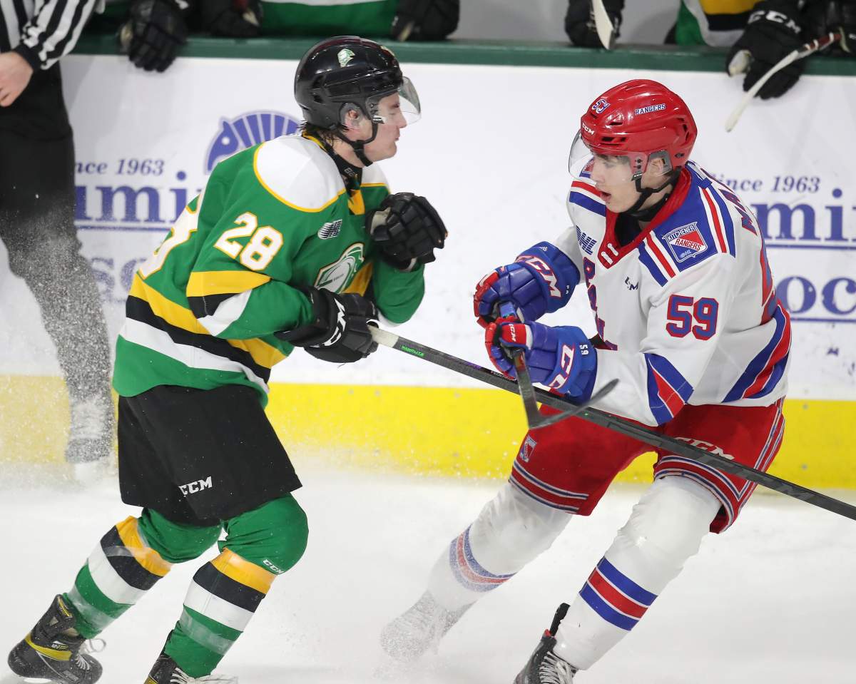 Connor Federkow of the Knights prepares to hit Mitchell Martin of the Rangers