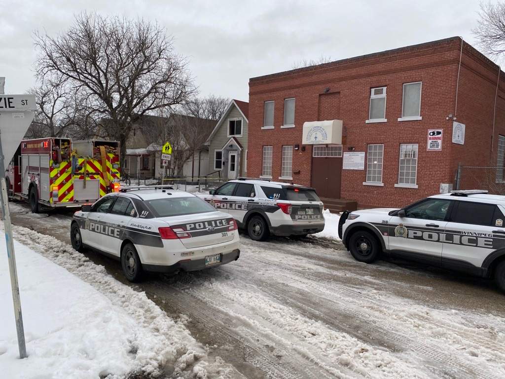 Winnipeg police at a Flora Avenue crime scene Wednesday morning.