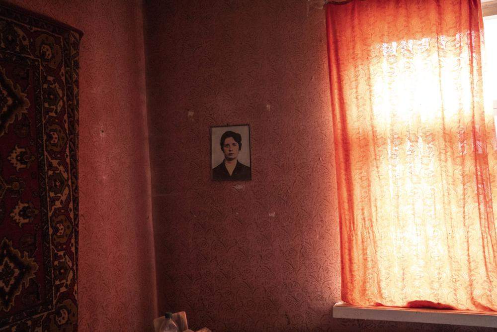 The portrait of Nadiya Trubchaninova, 70, mother of Vadym, 48, who was killed by Russian soldiers last March 30 in Bucha, decorates her bedroom on the outskirts of Kyiv, Ukraine, Thursday April 14, 2022.