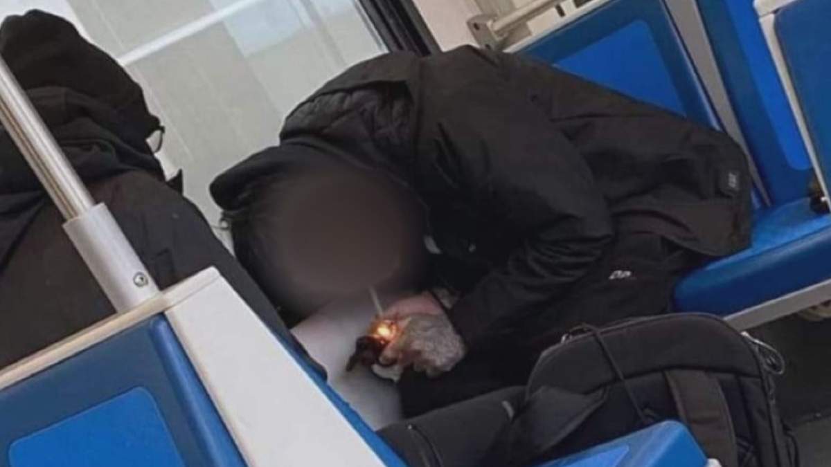 A man smoking on an LRT train in Edmonton in an undated photo